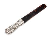 A Victorian Silver Mounted Tortoise Shell Page Turner, Maker's Mark Obscured, London, 1888, the handle worked to show foliate scrolls.
