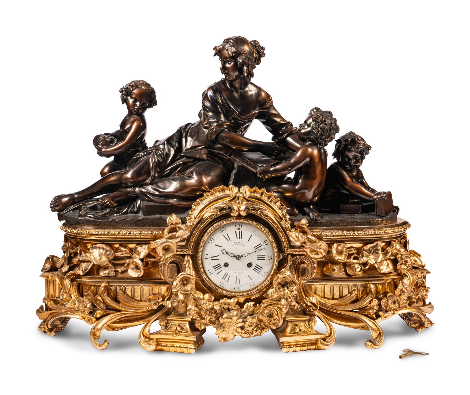 A French Gilt and Patinated Bronze Figural Mantel Clock