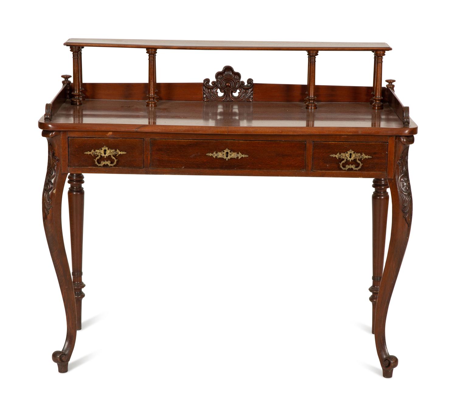 A Victorian Mahogany Lady's Writing Table with Shelf