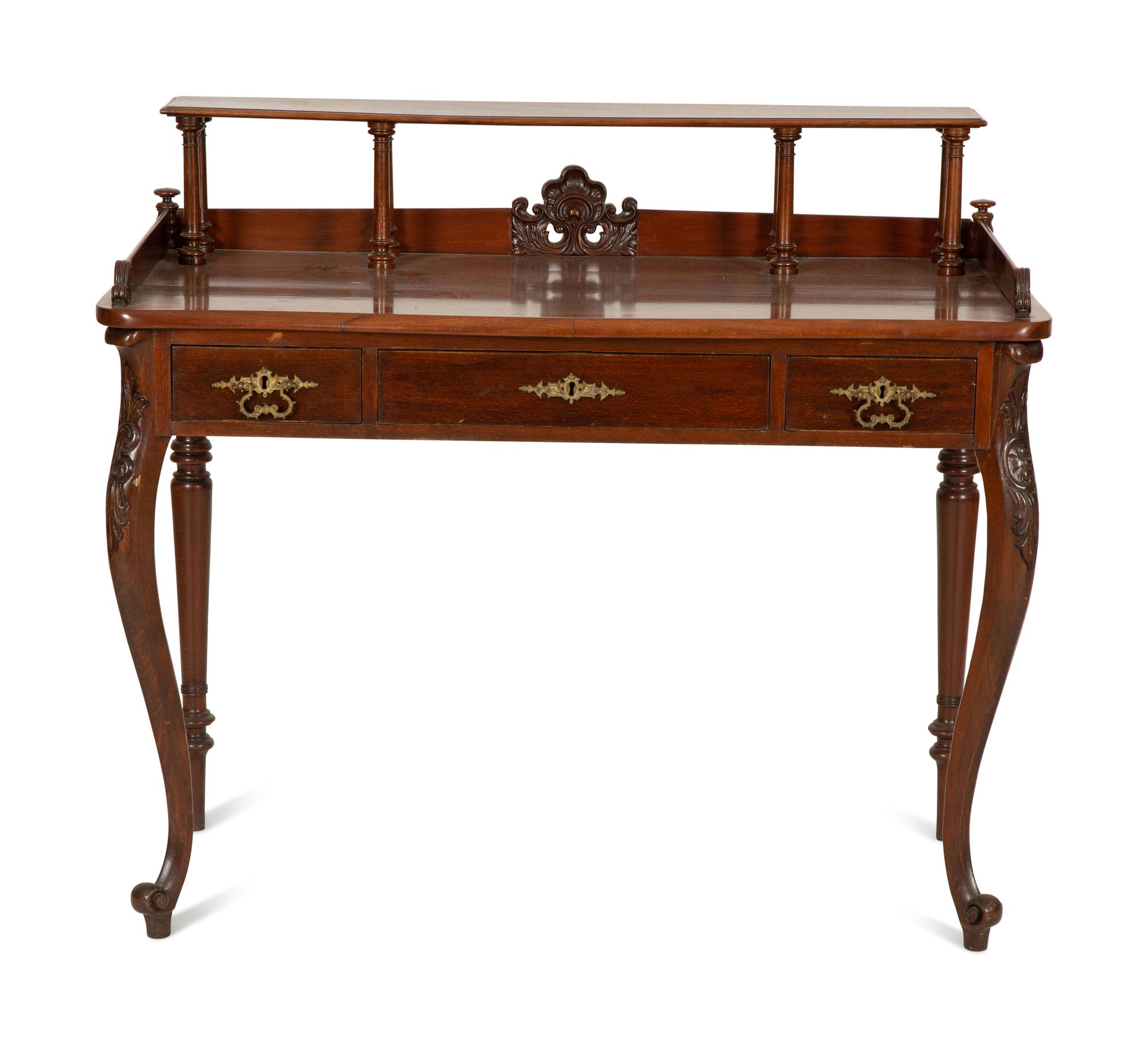 A Victorian Mahogany Lady's Writing Table with Shelf