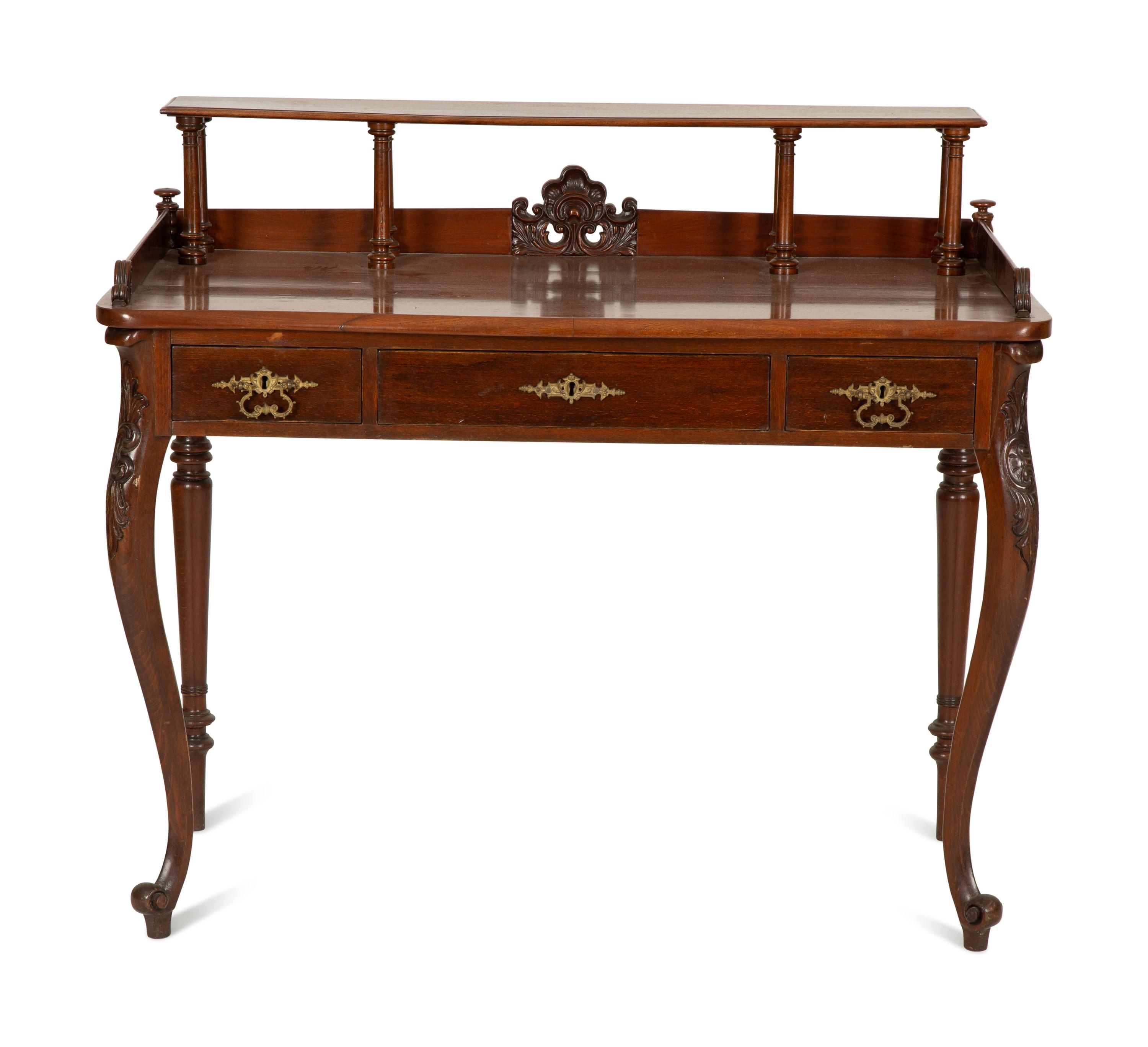 A Victorian Mahogany Lady's Writing Table with Shelf