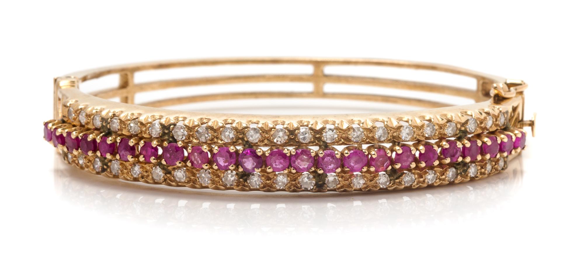 A Yellow Gold, Ruby and Diamond Bangle Bracelet, 16.70 dwts.