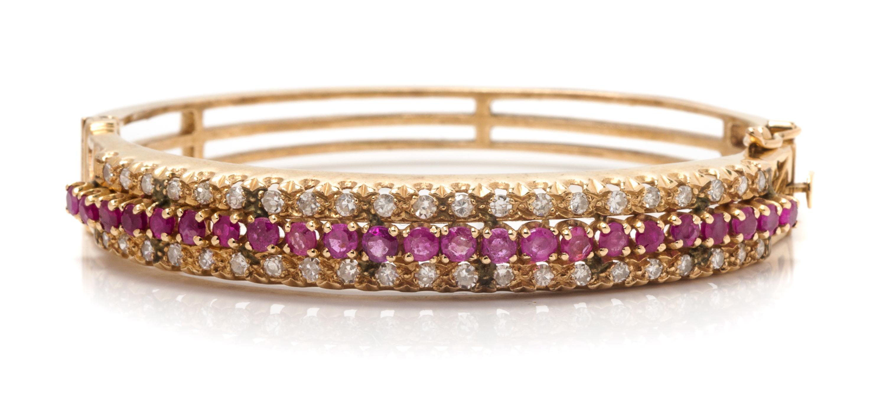 A Yellow Gold, Ruby and Diamond Bangle Bracelet, 16.70 dwts.