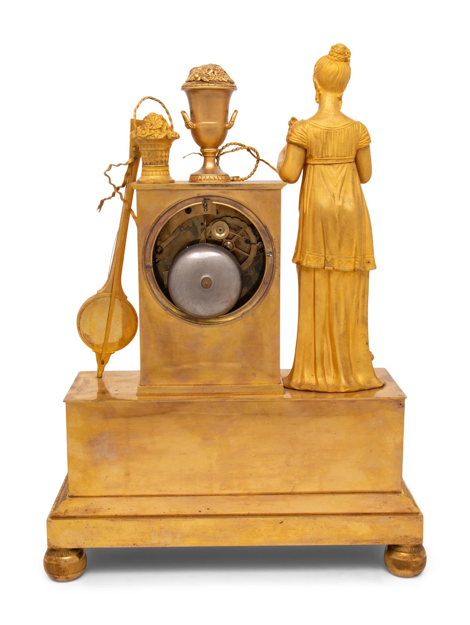An Empire Gilt Bronze Musical Clock