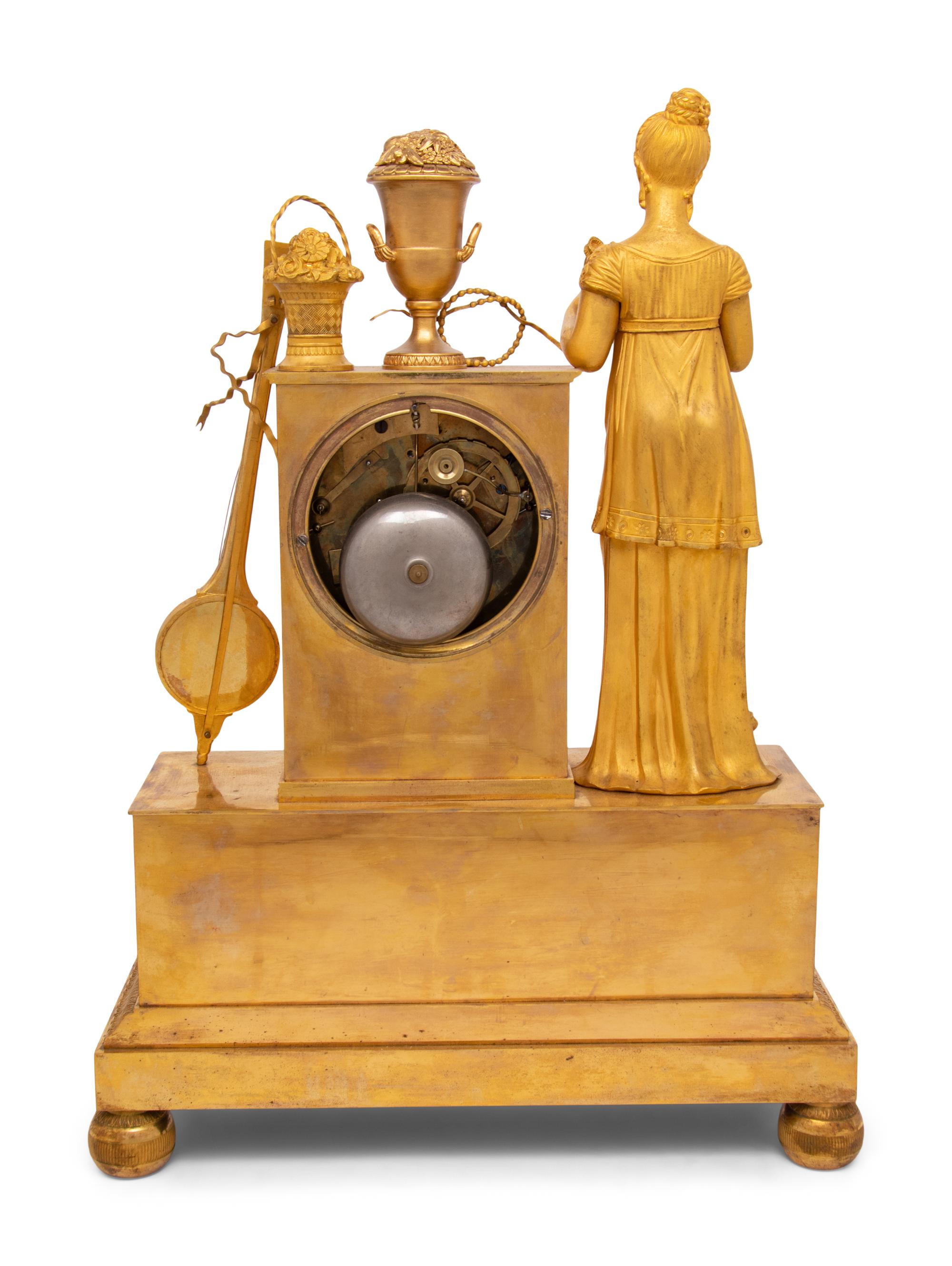 An Empire Gilt Bronze Musical Clock