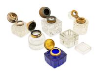 A Group of Silver and Brass Mounted Crystal Inkwells