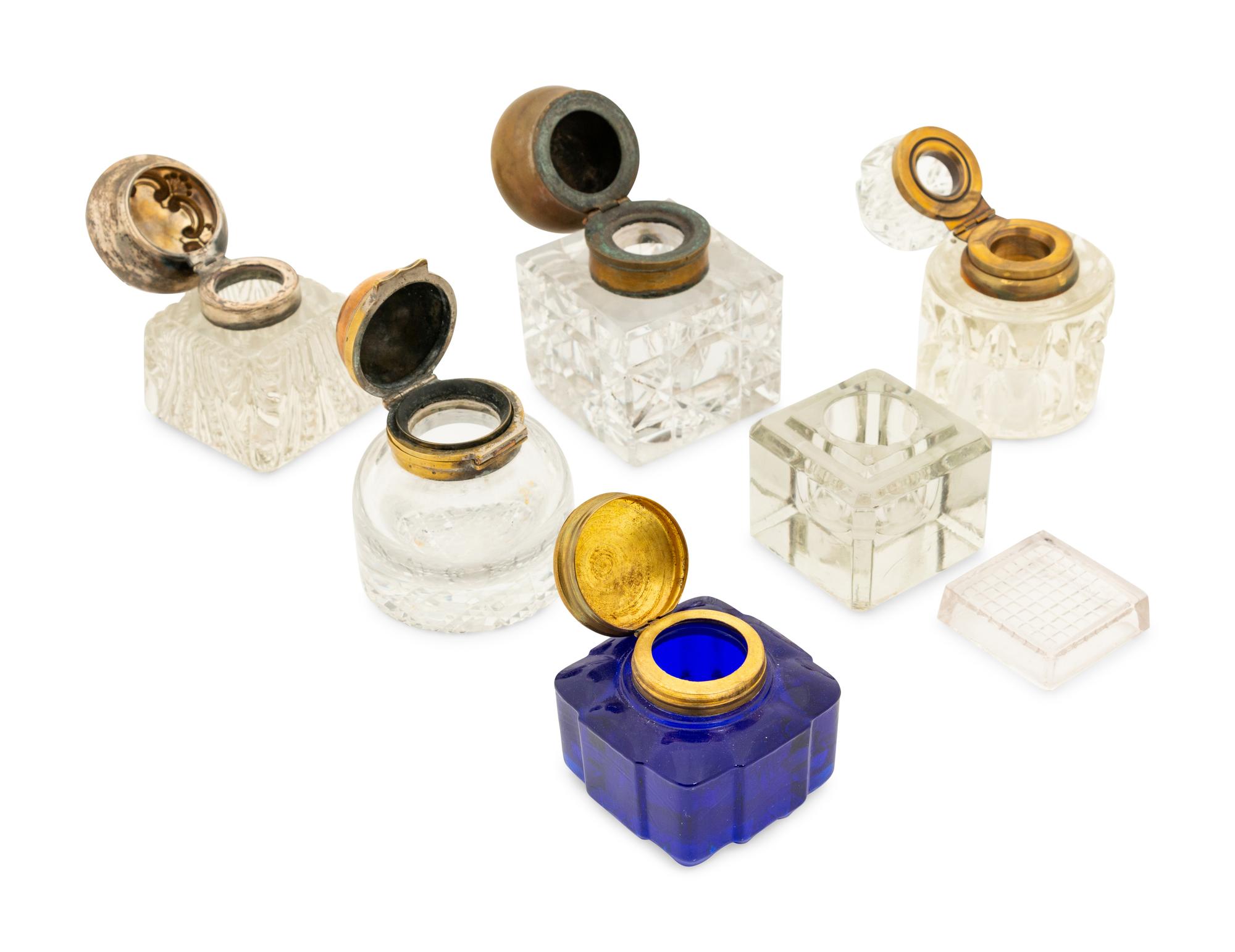 A Group of Silver and Brass Mounted Crystal Inkwells