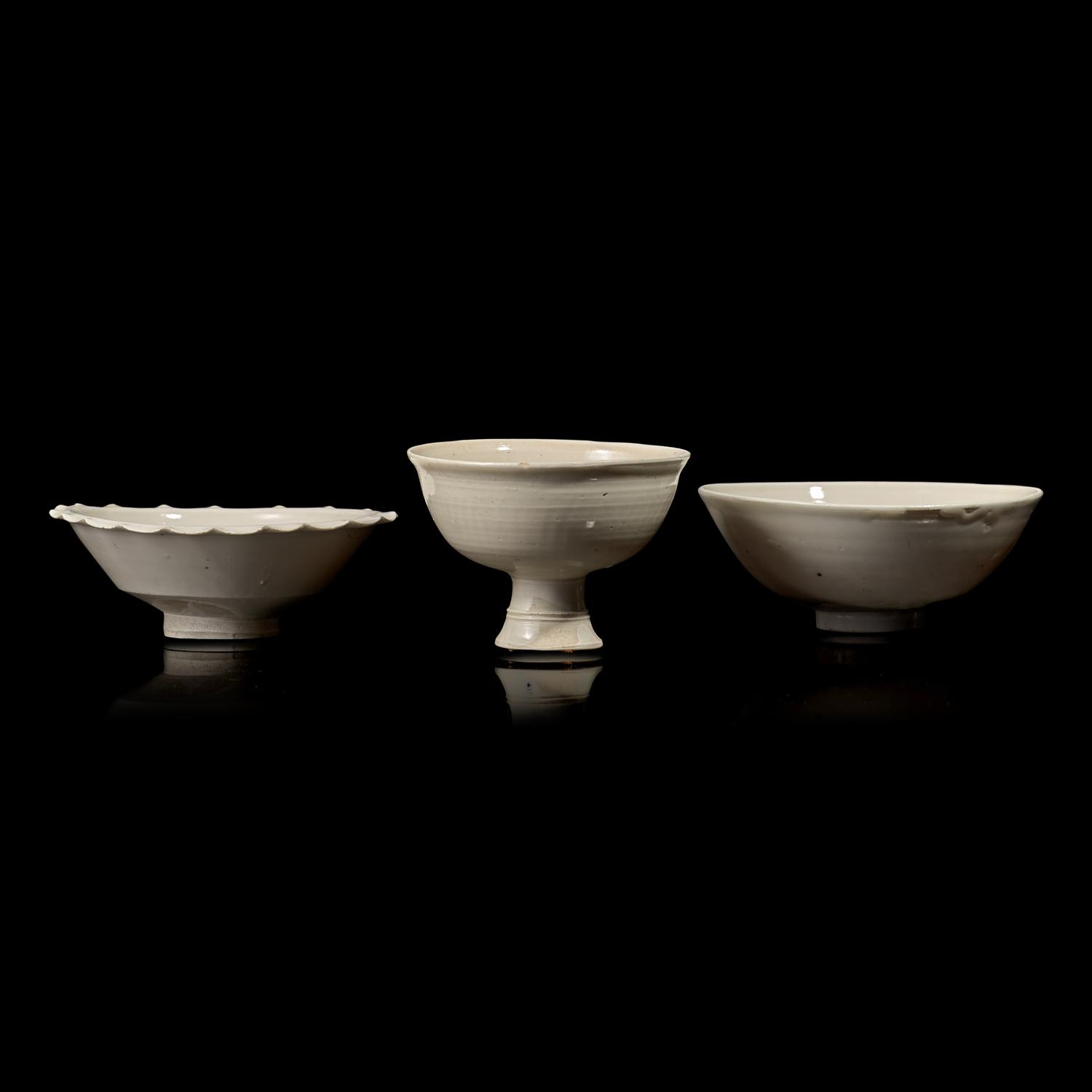 Two Chinese Huozhou White Glazed Bowls and a Stem Cup, Song Dynasty 宋 霍州窯白釉瓷碗二及高足杯一