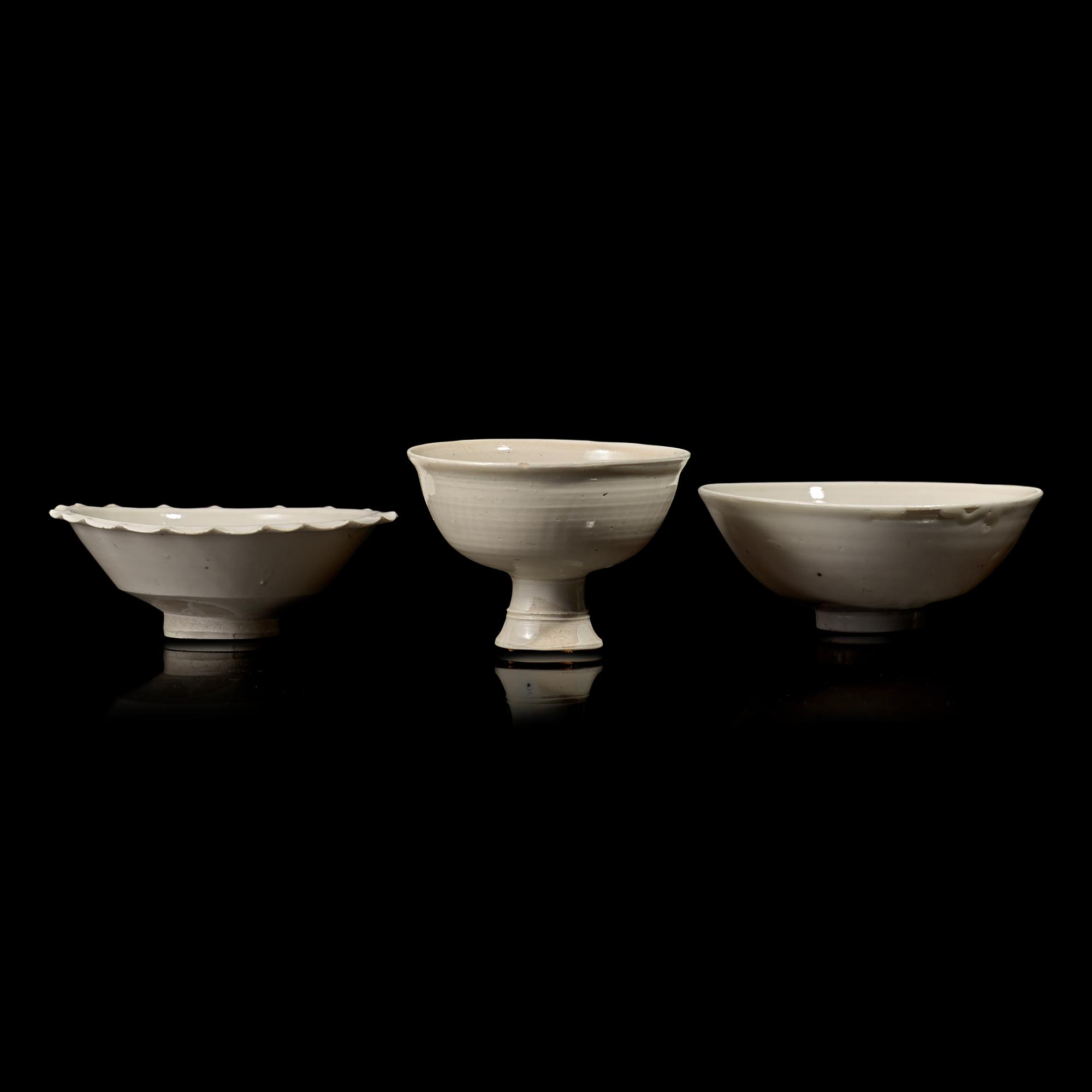 Two Chinese Huozhou White Glazed Bowls and a Stem Cup, Song Dynasty 宋 霍州窯白釉瓷碗二及高足杯一