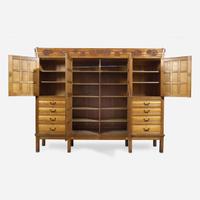 A large English Aesthetic Movement oak wardrobe Attributed to Richard Norman Shaw (1831-1912) & William Eden Nesfield (1835-1888), retailed by Maple & Co. (est. 1841), London, England, circa 1870