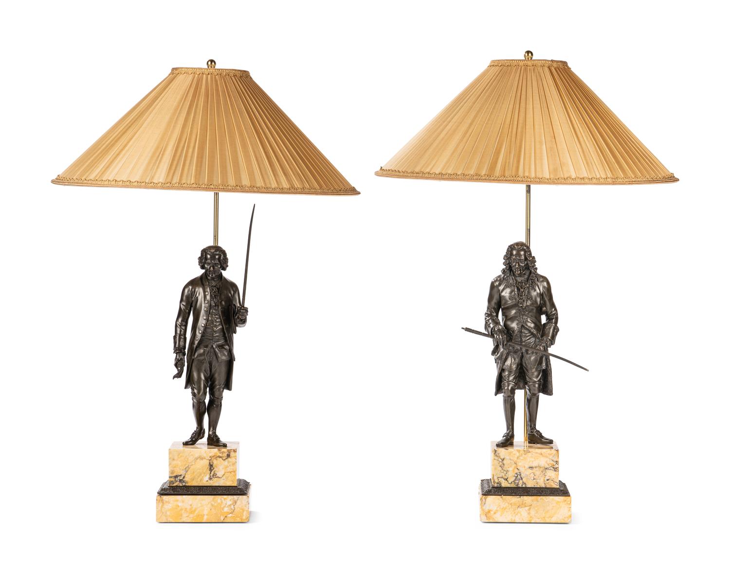 A Pair of French Bronze and Sienna Marble Sculptures of Voltaire and Rousseau