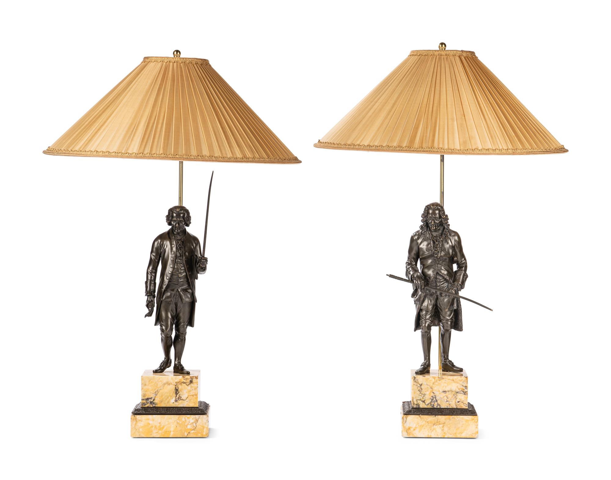 A Pair of French Bronze and Sienna Marble Sculptures of Voltaire and Rousseau