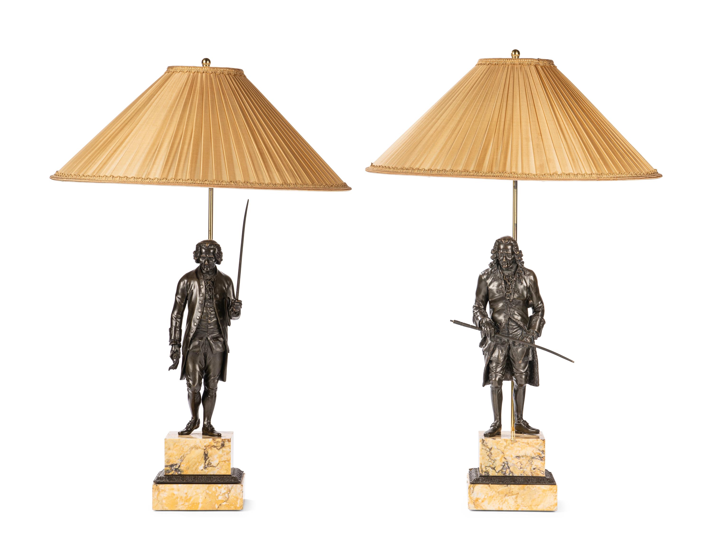 A Pair of French Bronze and Sienna Marble Sculptures of Voltaire and Rousseau