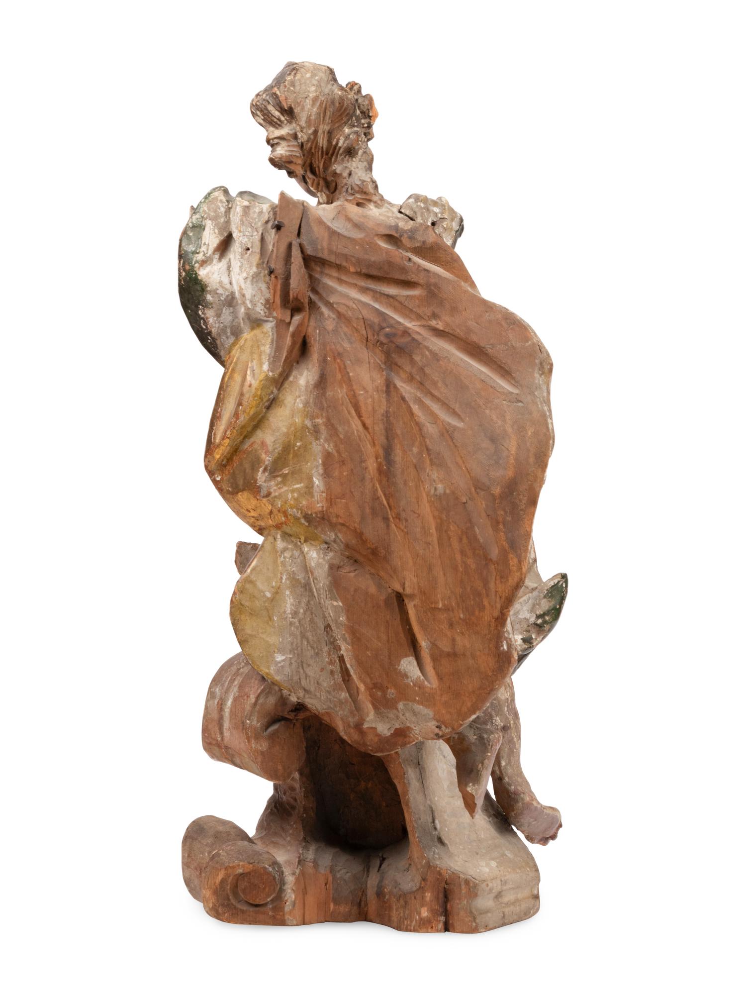 An Italian Polychrome Painted and Parcel-Gilt Figure of a Saint