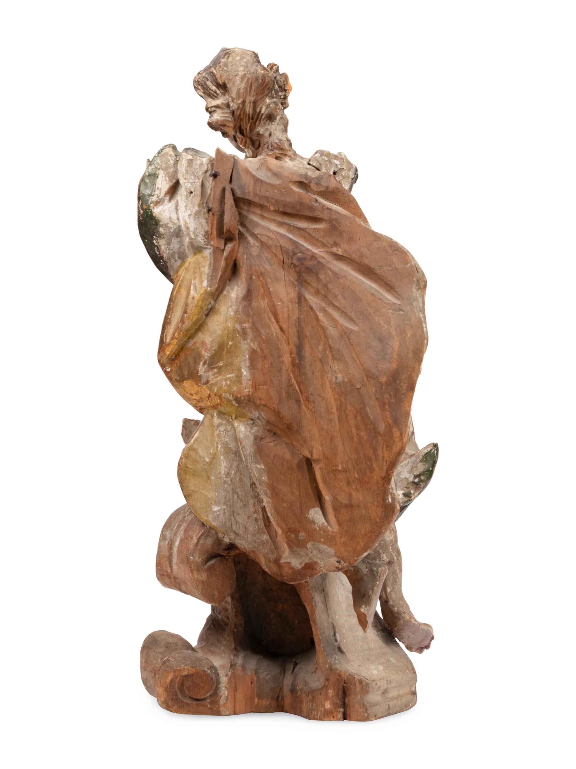 An Italian Polychrome Painted and Parcel-Gilt Figure of a Saint