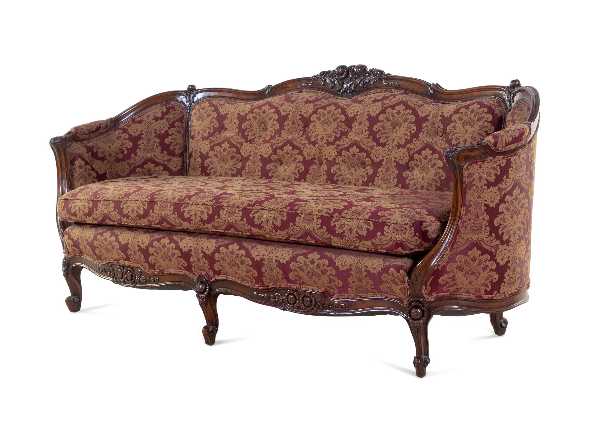 A Rococo Revival Carved Walnut Sofa
