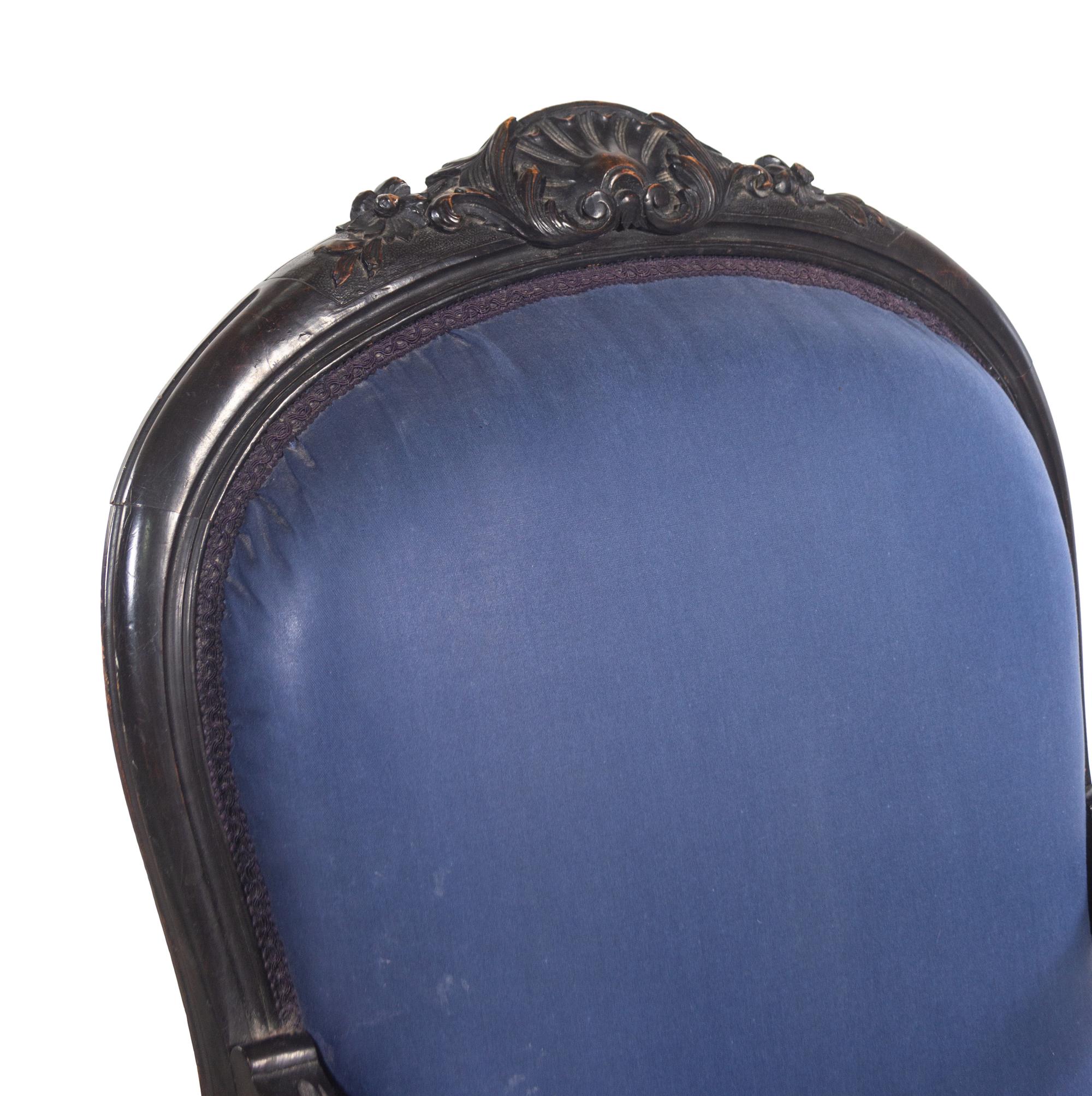 A Rococo Revival Ebonized Walnut Four-Piece Parlor Suite