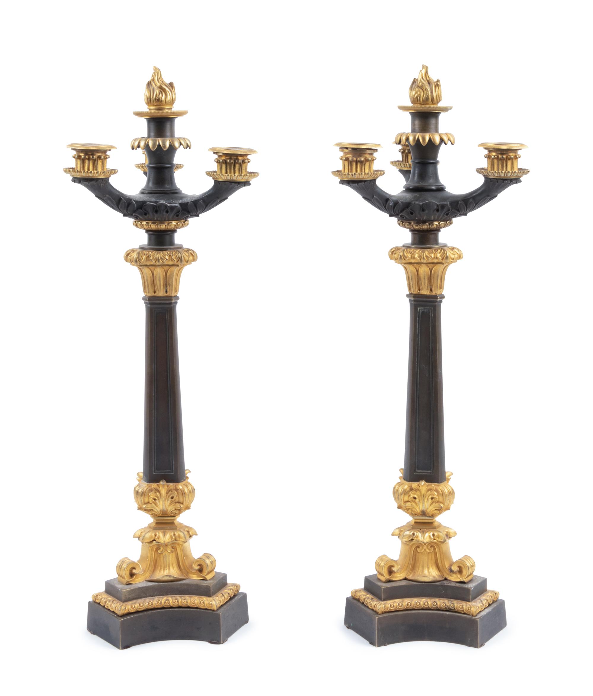 A Pair of Charles X Style Gilt and Patinated Bronze Four-Light Candelabra