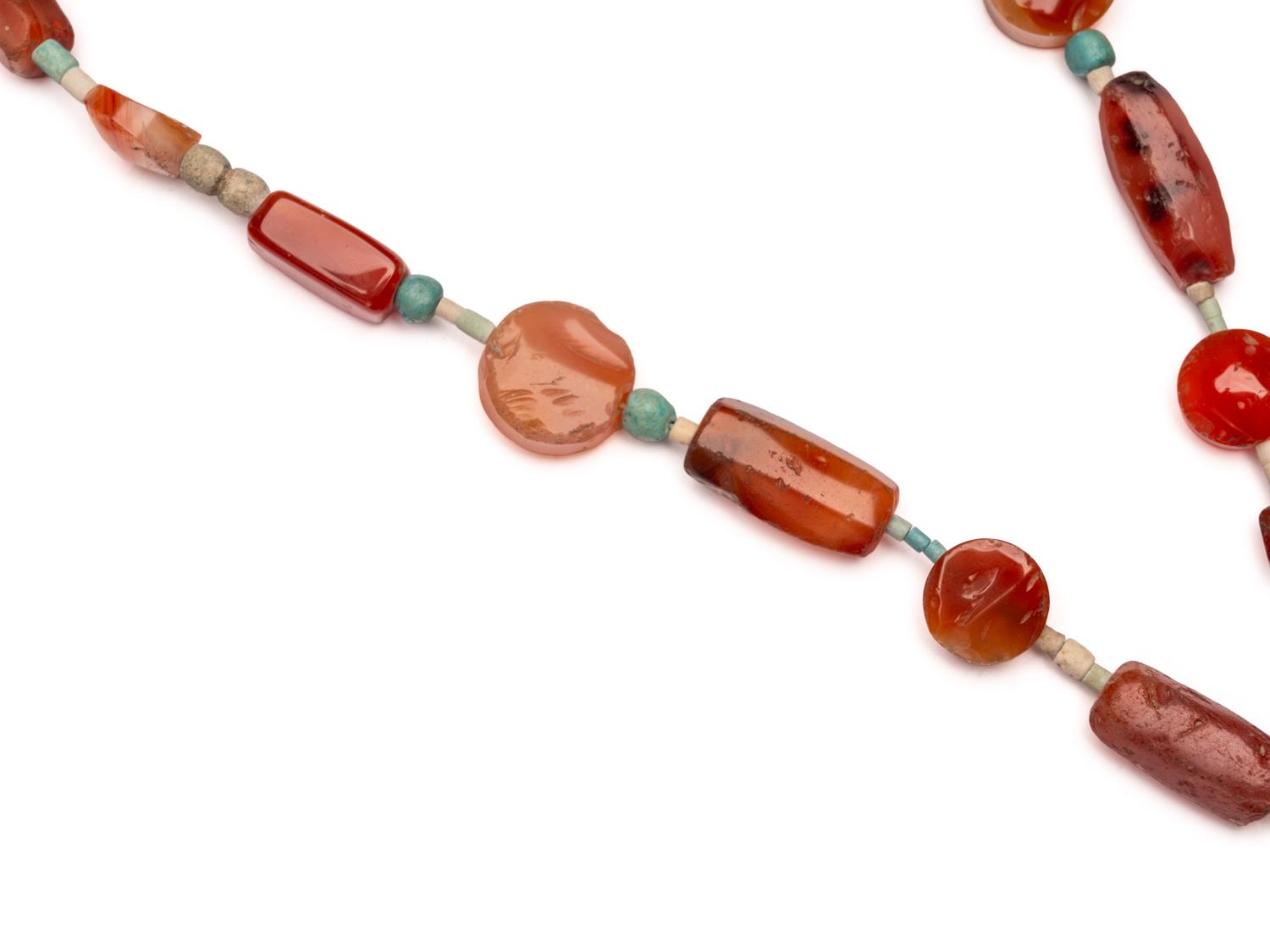 An Egyptian Carnelian and Faience Necklace