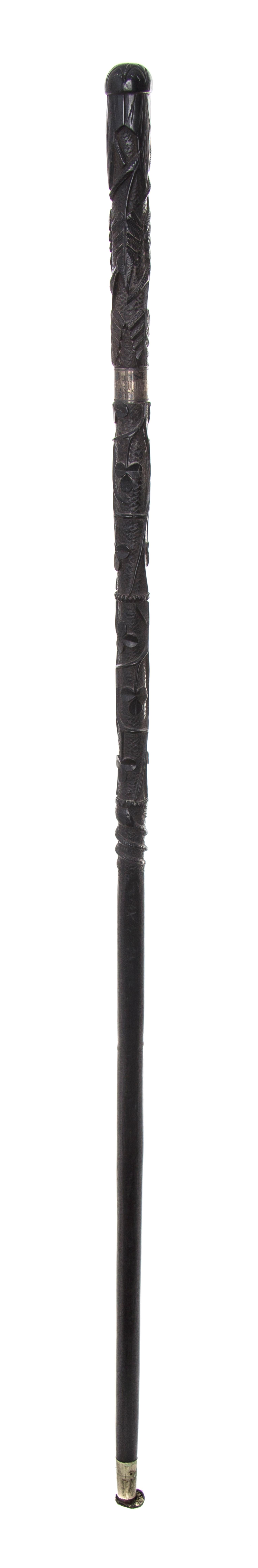 An Irish Carved Wood Walking Stick, Length of handle 6 x length overall 34 1/2 inches.