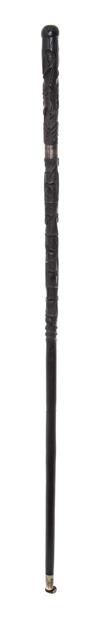 An Irish Carved Wood Walking Stick, Length of handle 6 x length overall 34 1/2 inches.