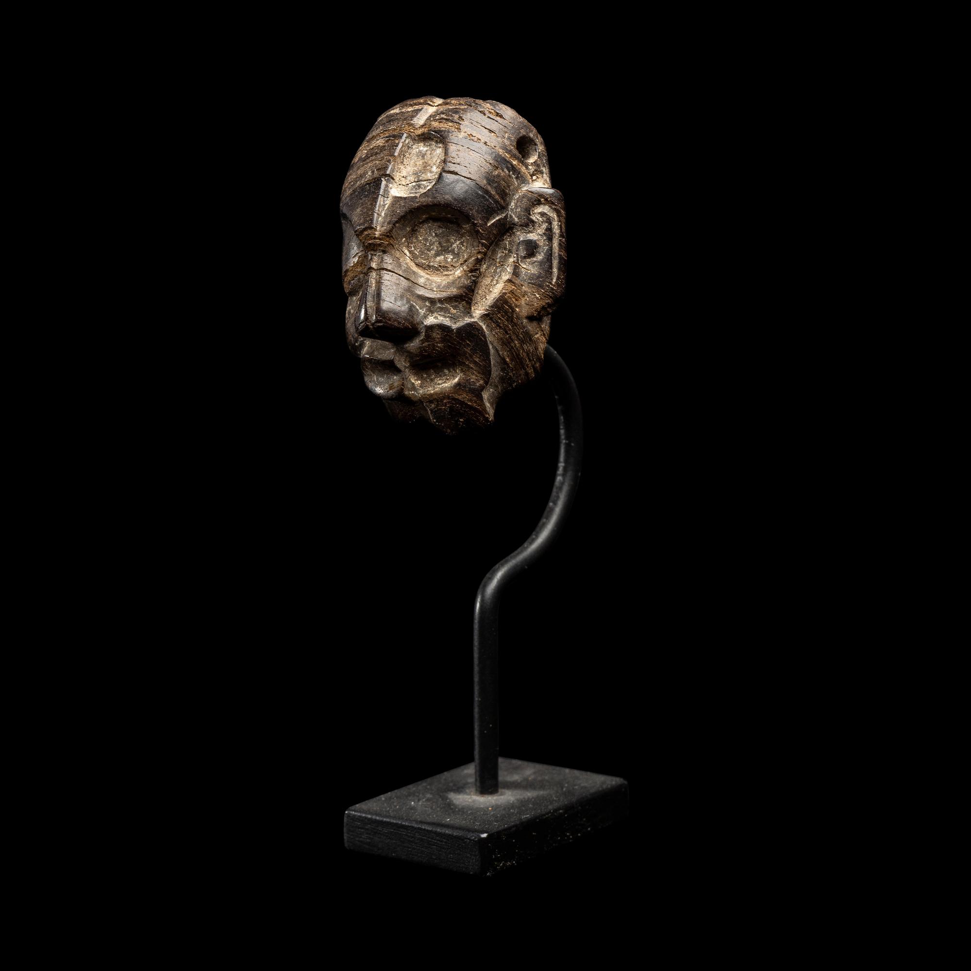 A Maya Wood Head Pendant