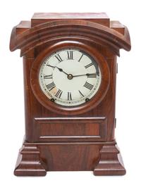 A Victorian Mahogany Mantle Clock Height 15 1/4 inches.