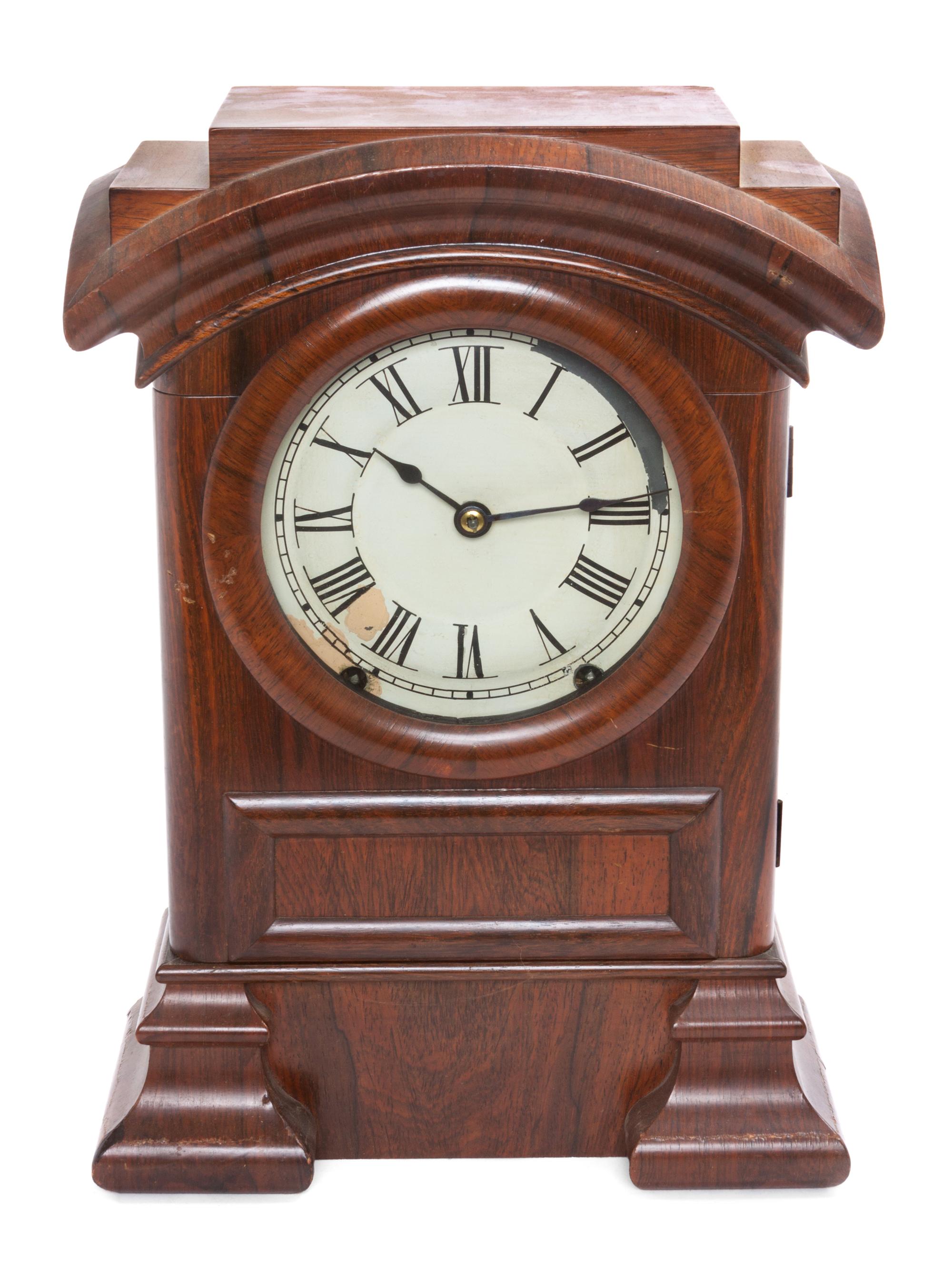 A Victorian Mahogany Mantle Clock Height 15 1/4 inches.