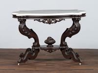 A Renaissance Revival Carved Walnut Marble Top Center Table