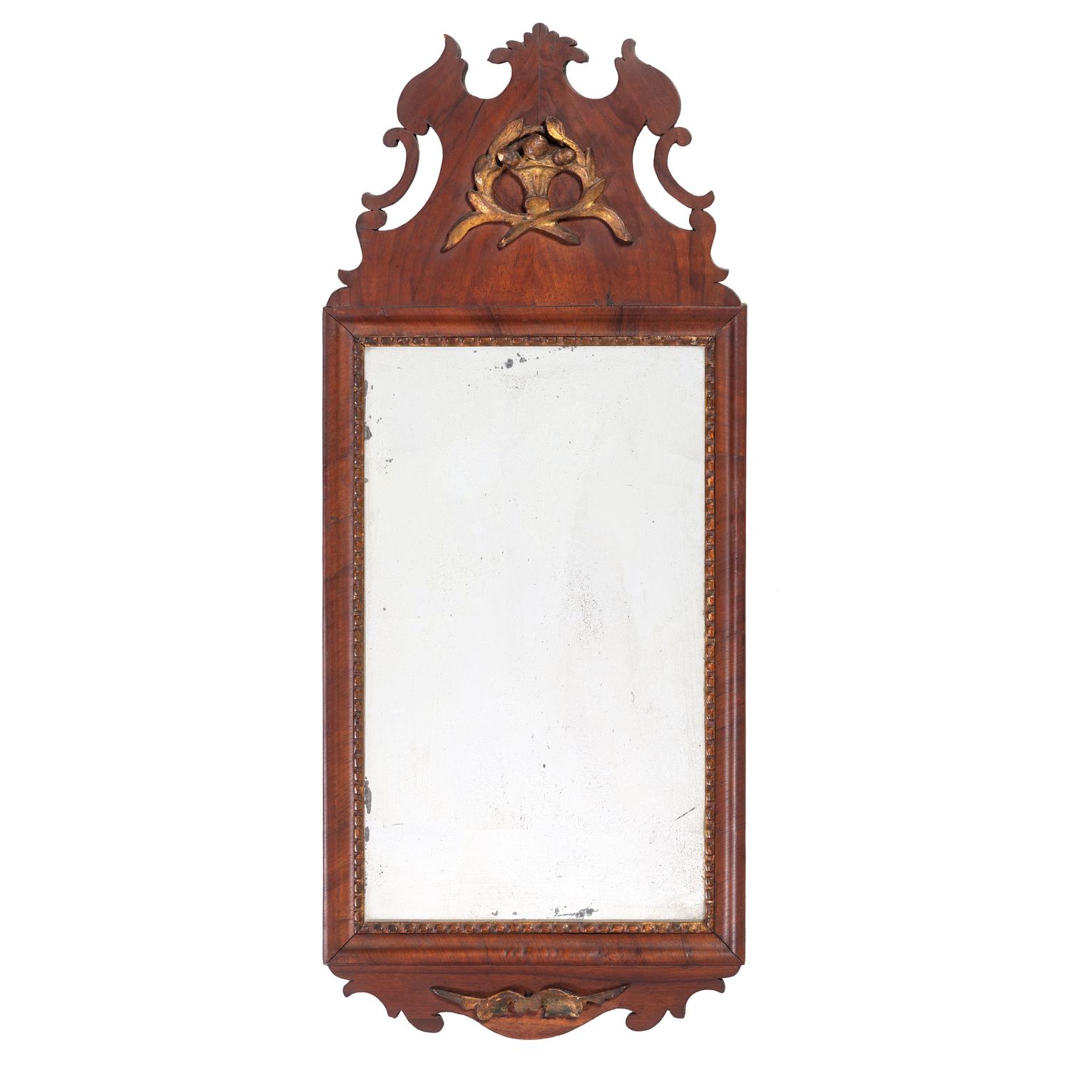 A Chippendale Parcel Gilt and Figured Walnut Looking Glass