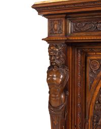 A Pair of Renaissance Revival Carved Walnut Marble-Top Cabinets