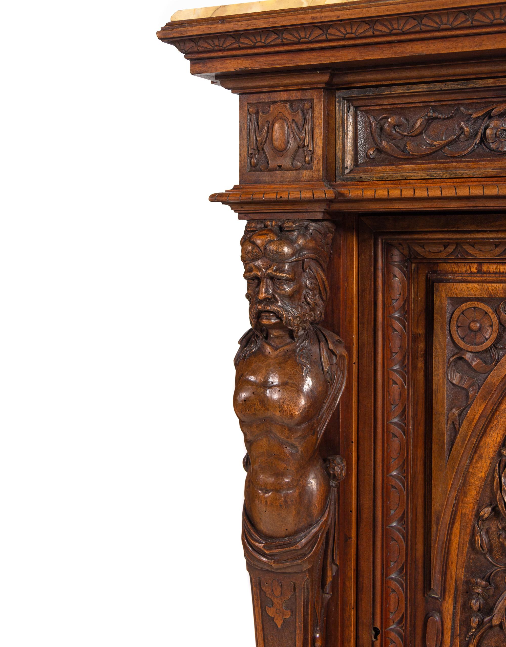 A Pair of Renaissance Revival Carved Walnut Marble-Top Cabinets