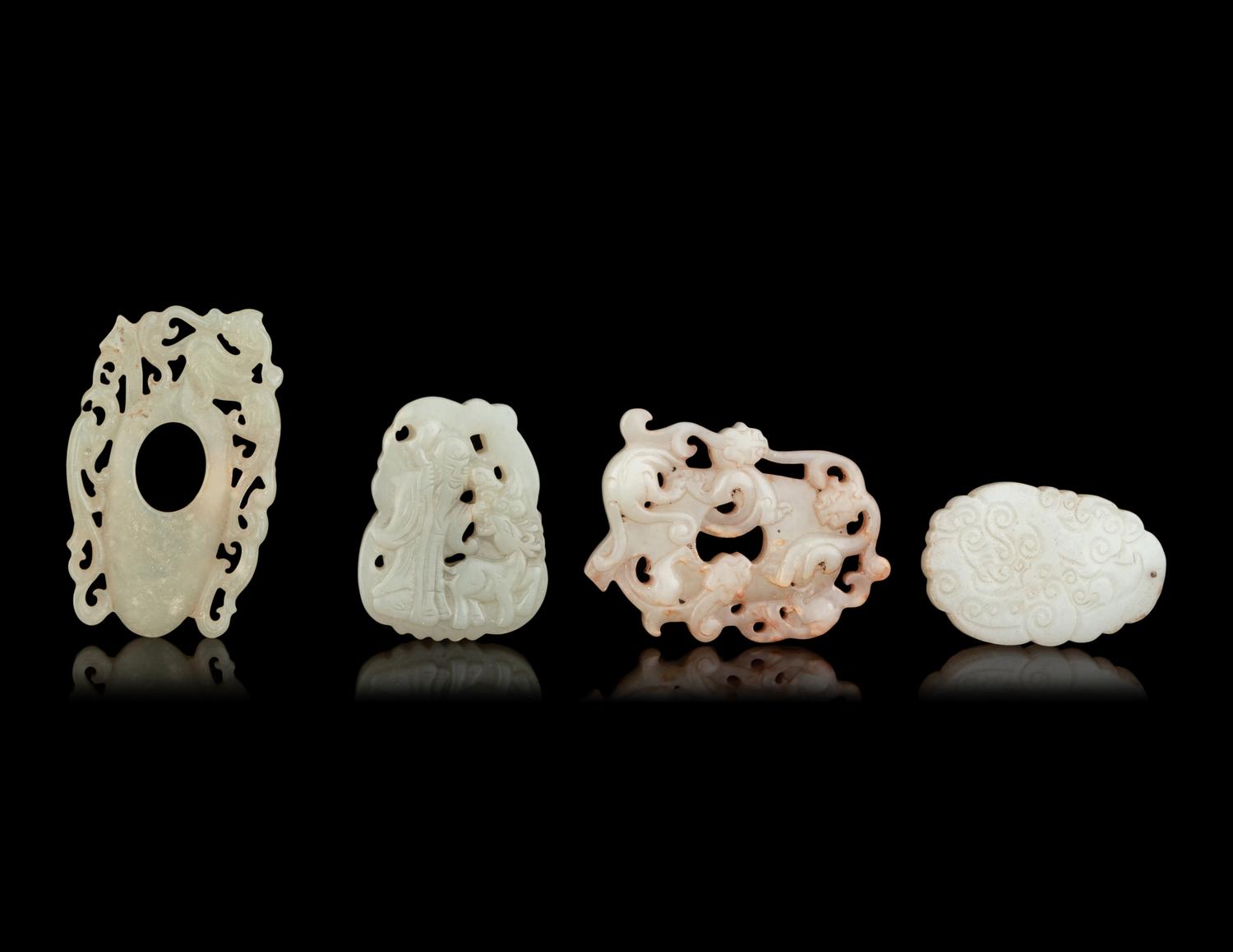 Seven Chinese Carved Celadon Jade Pendants