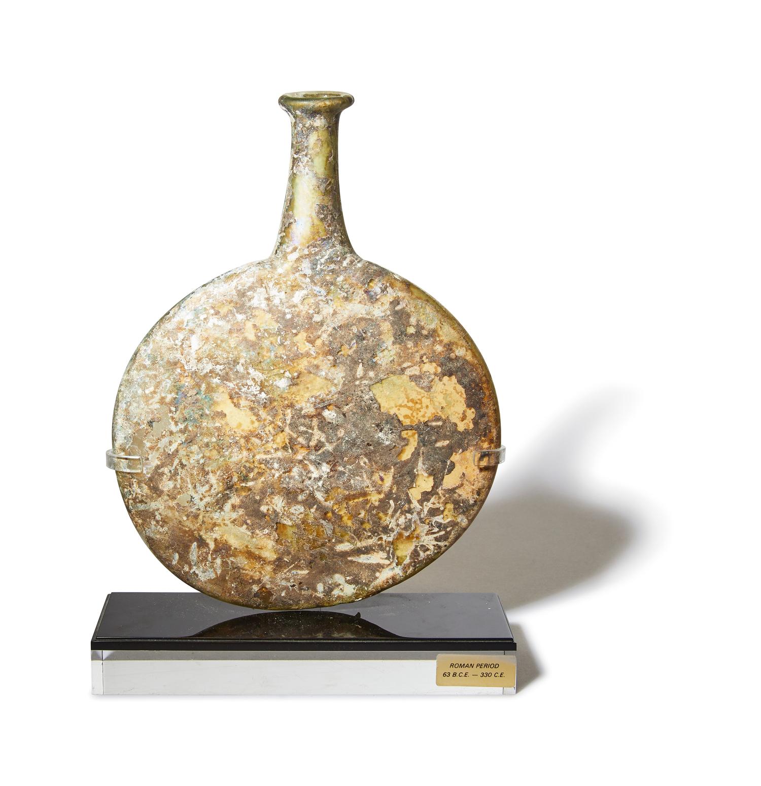 A Roman Green Glass Pilgrim Flask