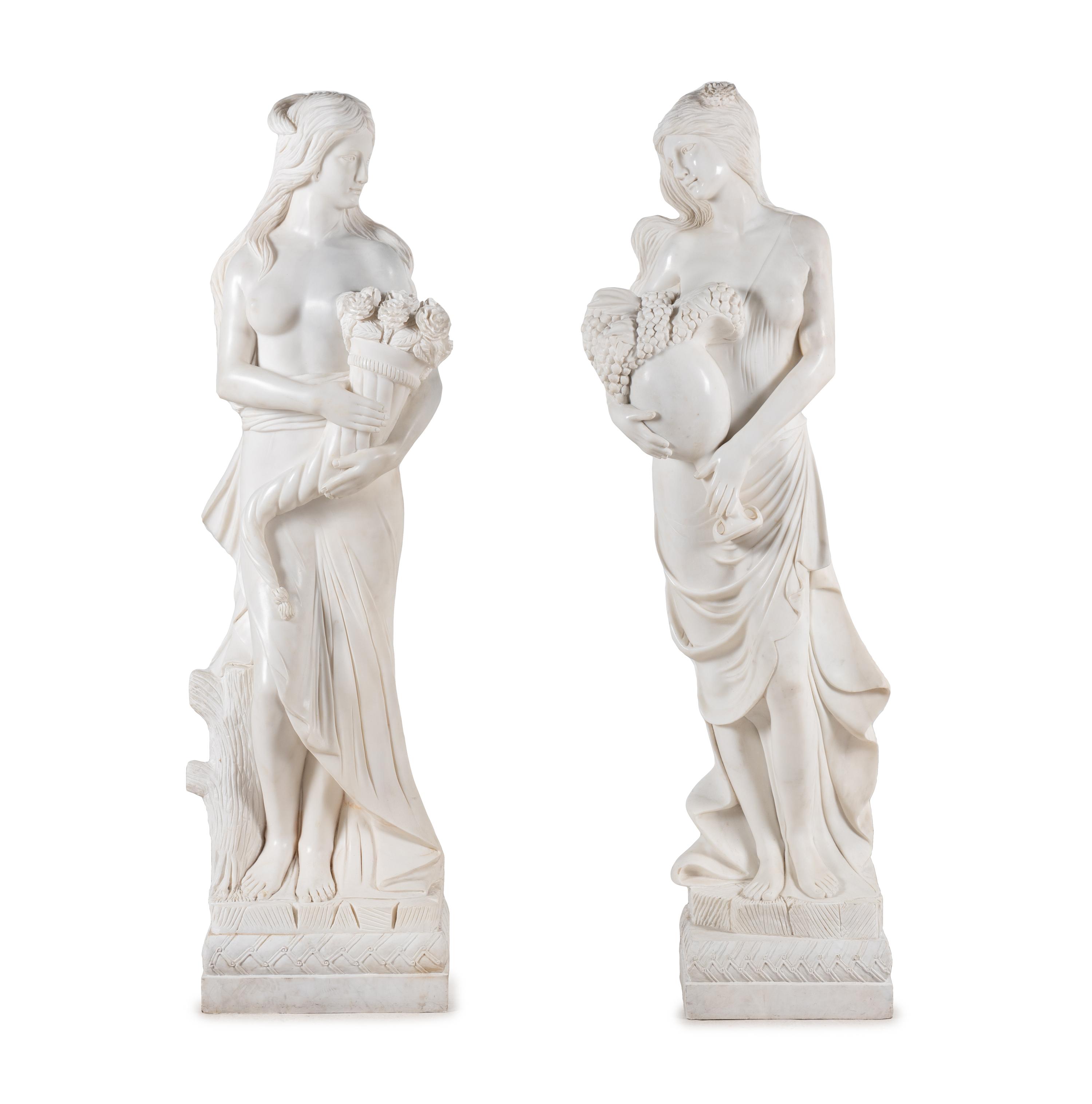 A Pair of Carved Marble 'Four Seasons' Figures