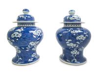 A Pair of Chinese Blue and White Porcelain 'Ice Crackle and Prunus' Baluster Jars and Covers