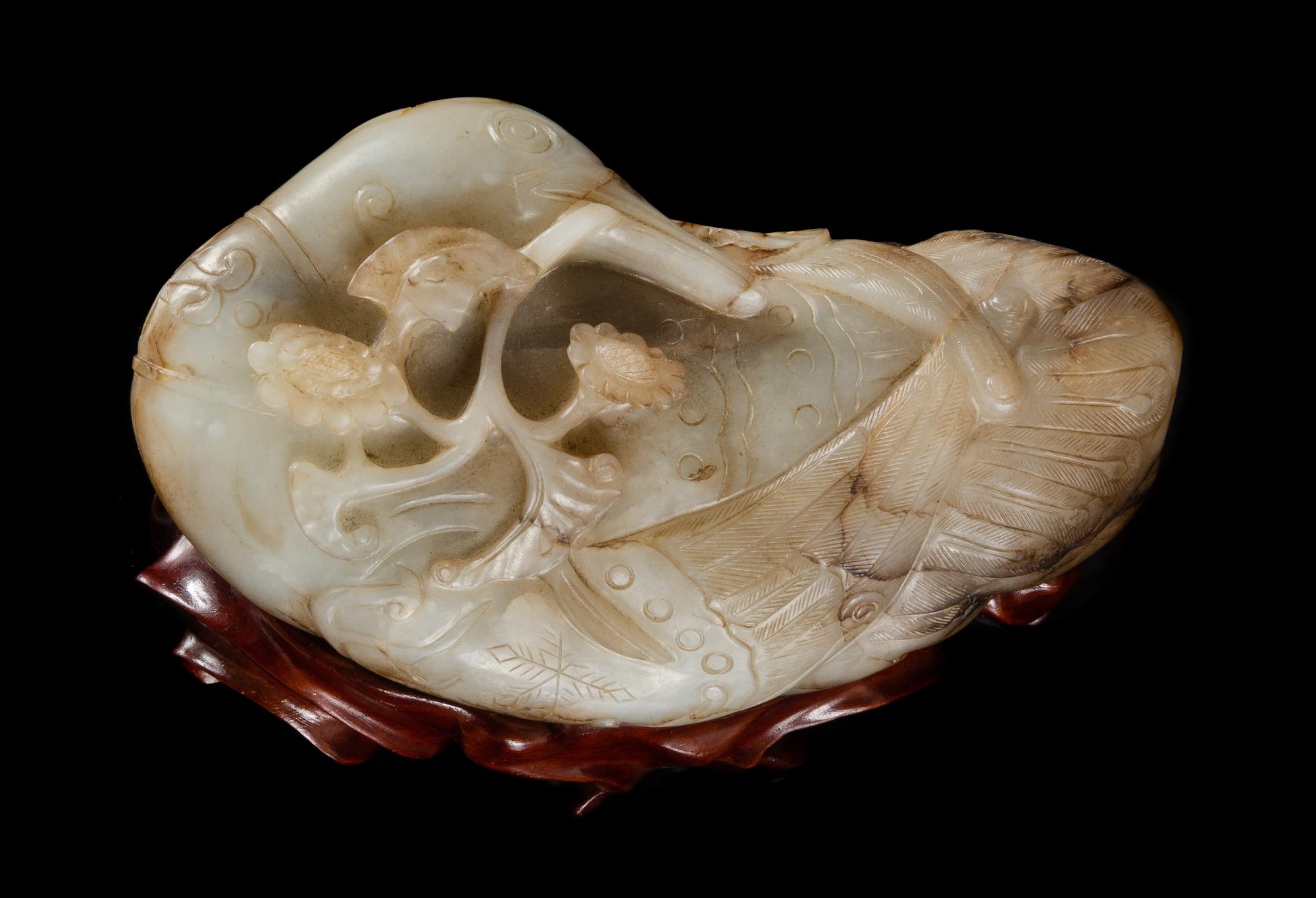 A Carved Black and White Jade Figure of a Duck Length 6 inches.