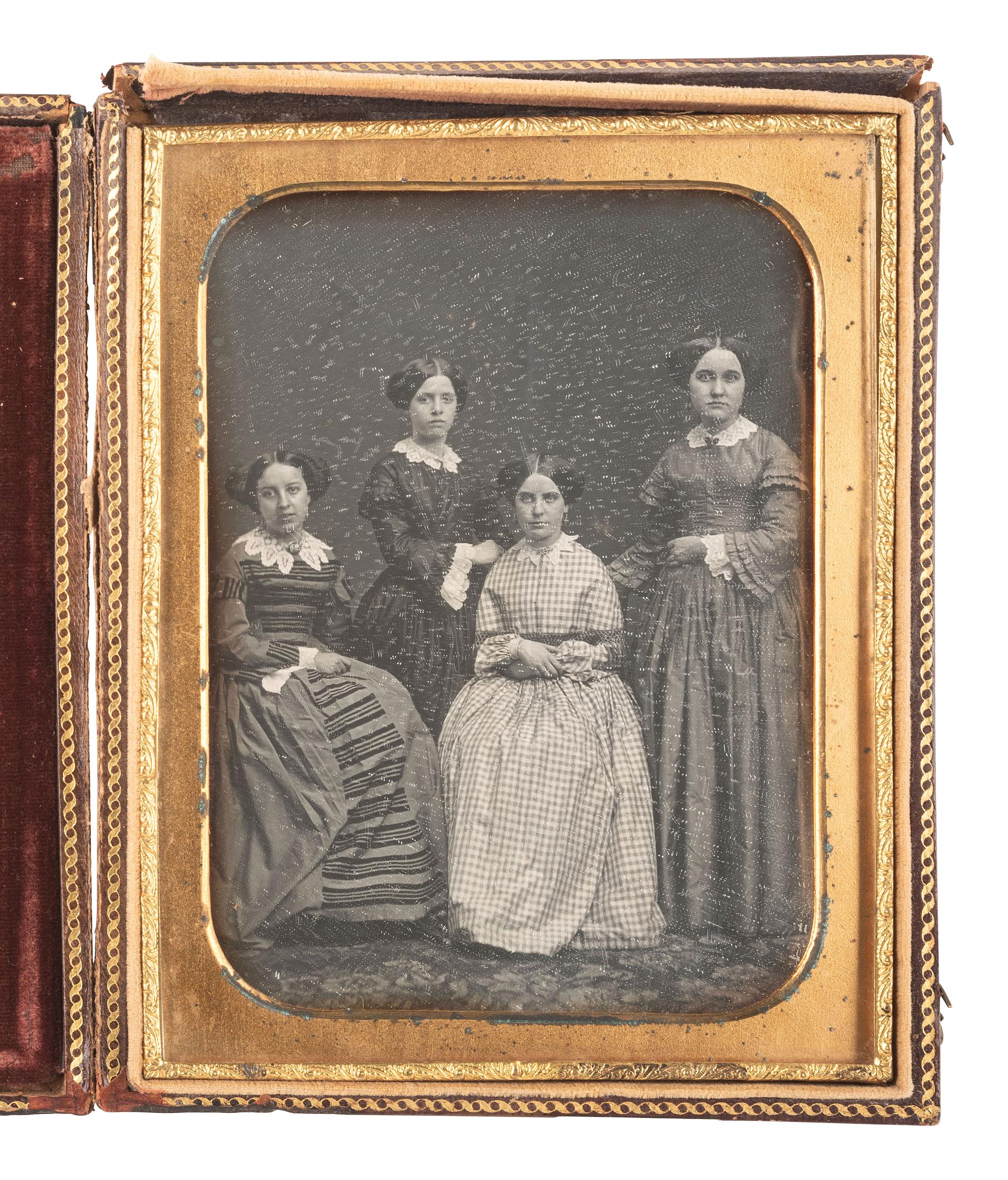 [EARLY PHOTOGRAPHY]. A pair of half plate daguerreotypes featuring groups of women, incl. a portrait of a large female class and a smaller group portrait by MEAD BROTHERS, NY.