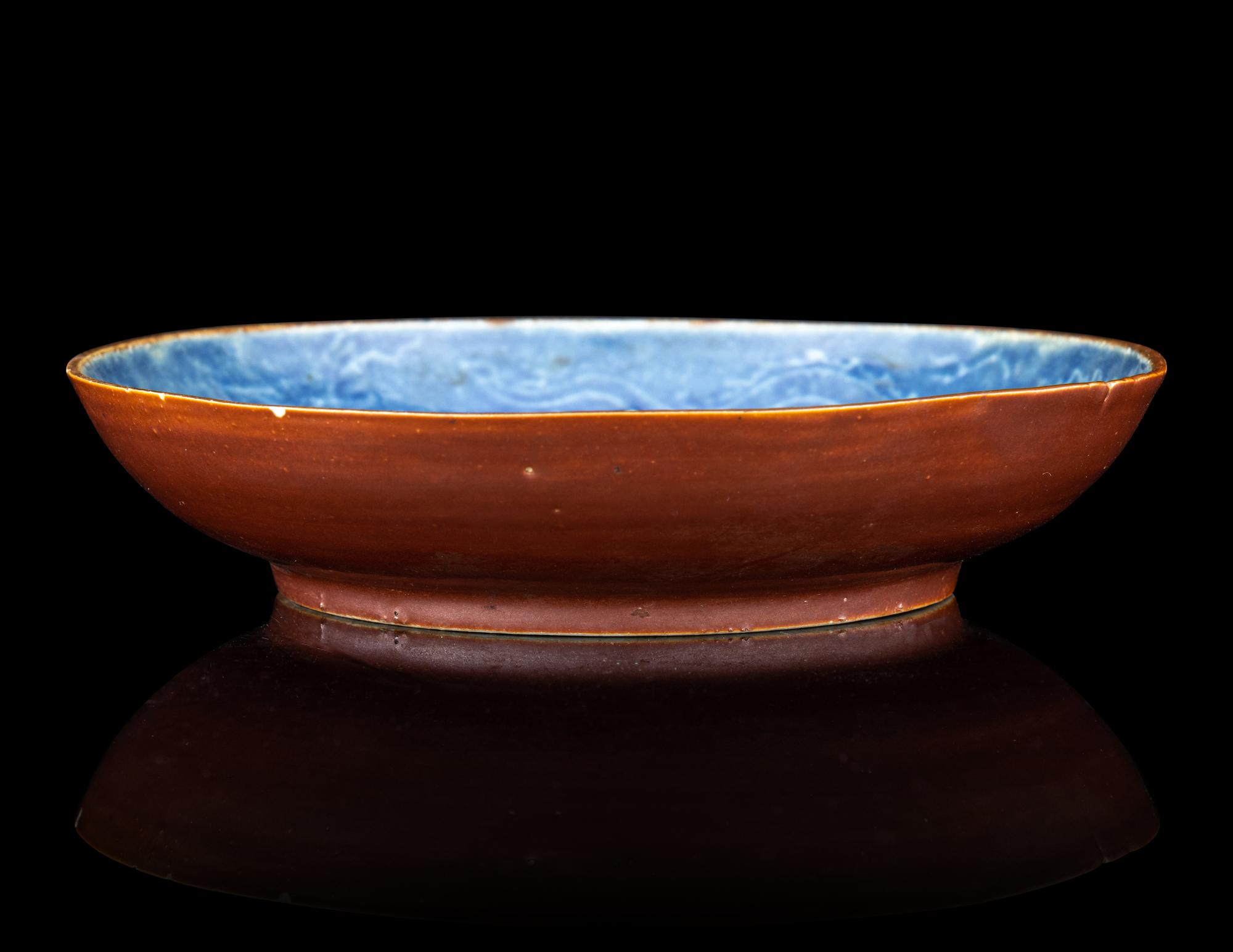A Carved Blue Glazed Porcelain 'Dragon and Cloud' Plate