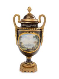 A Sèvres Style Gilt Bronze Mounted Painted and Parcel Gilt Porcelain Covered Urn
