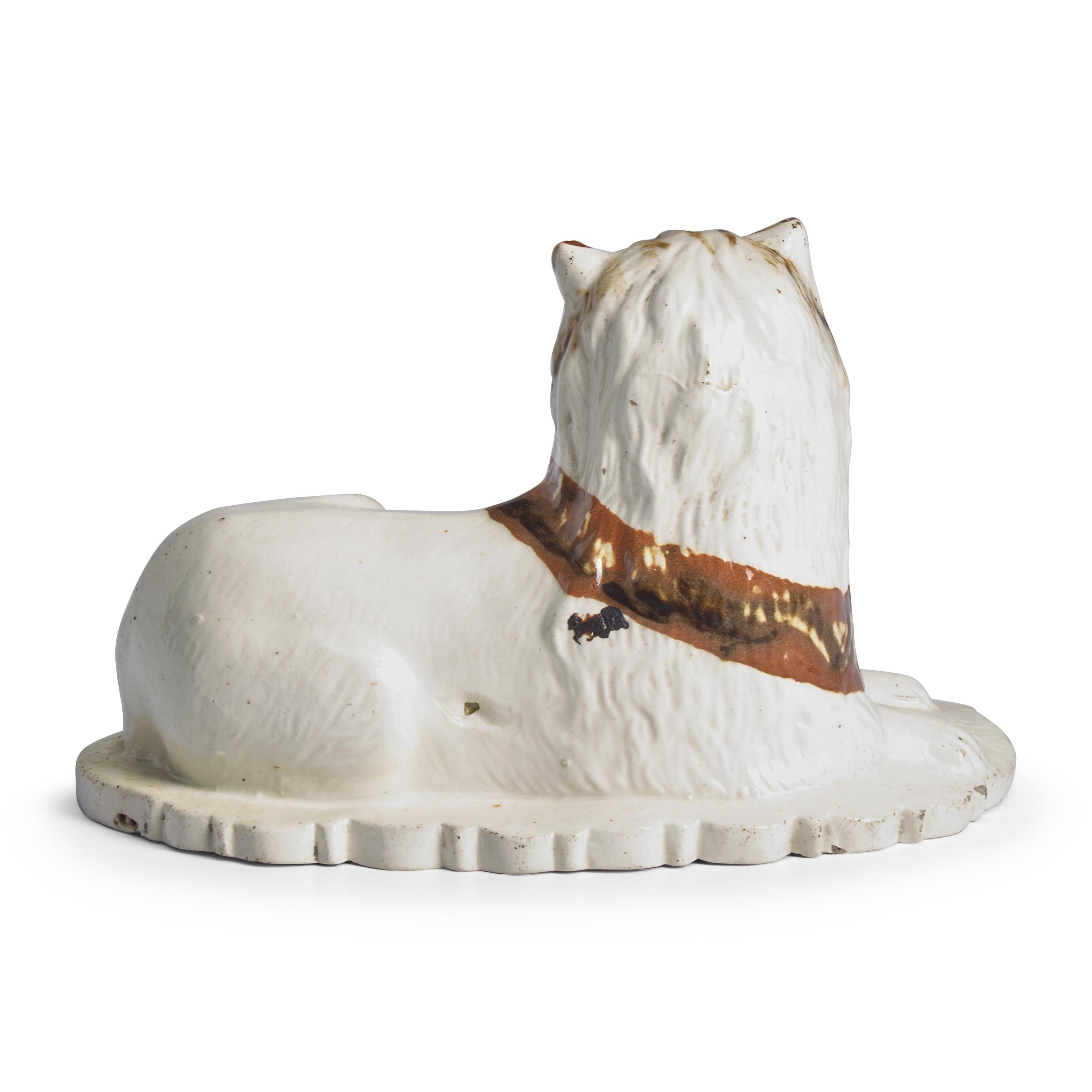 A Creamware Figure of a Seated Lion