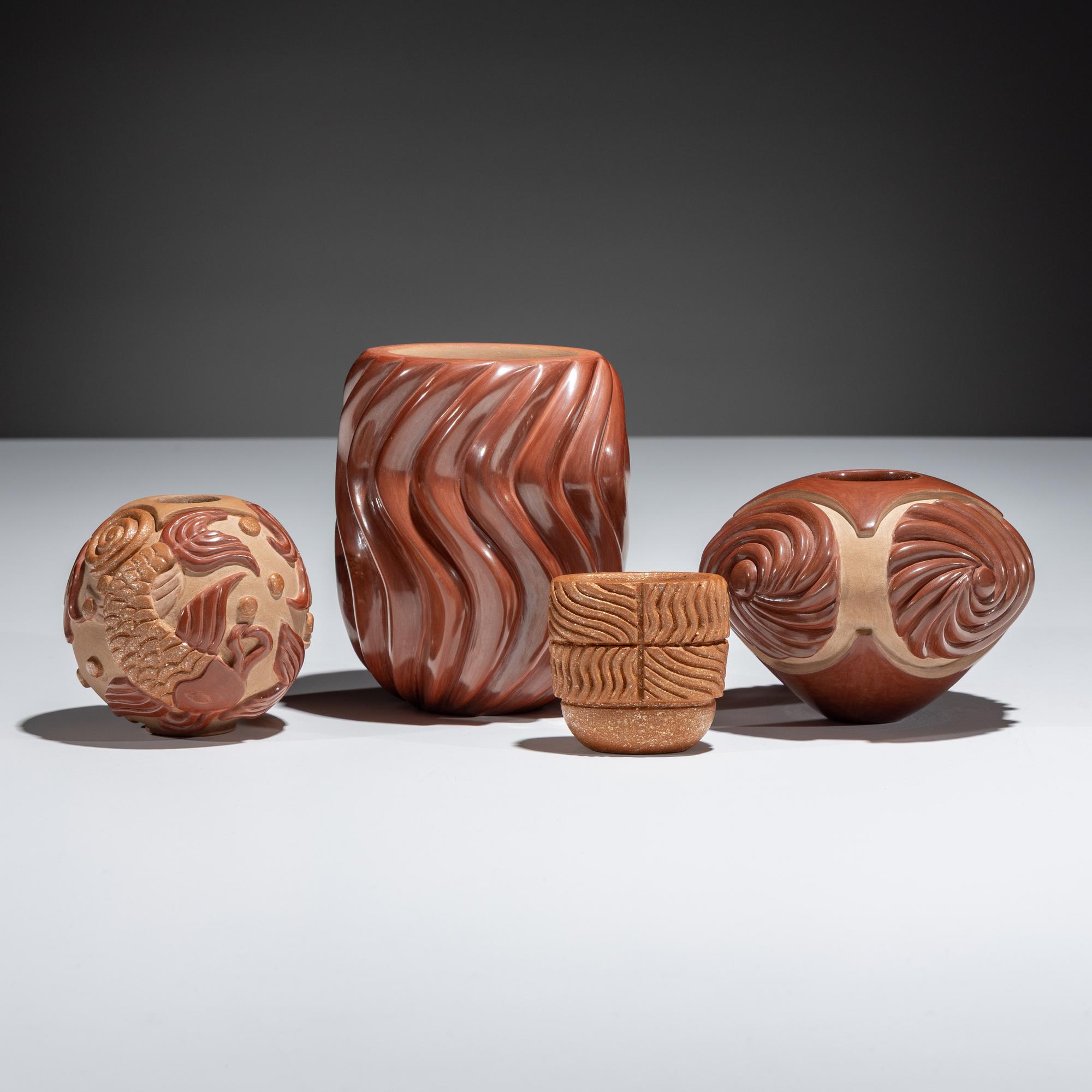 Red and Tan Carved Pottery