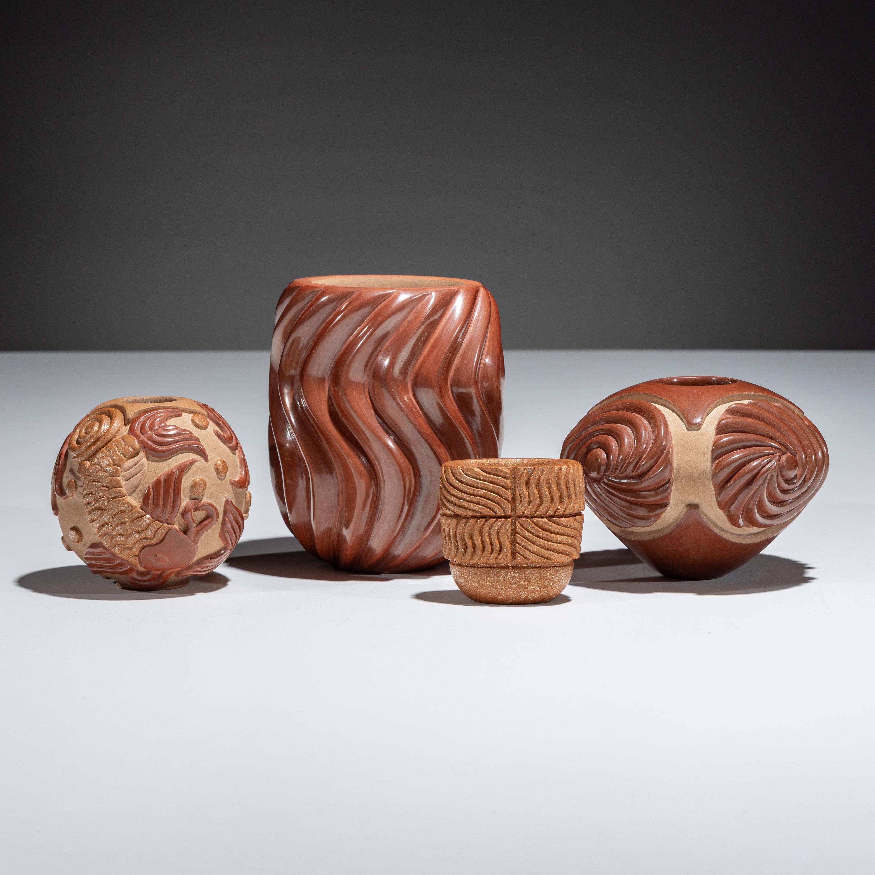 Red and Tan Carved Pottery
