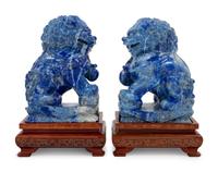 A Pair of Carved Lapis Lazuli Buddhist Lions