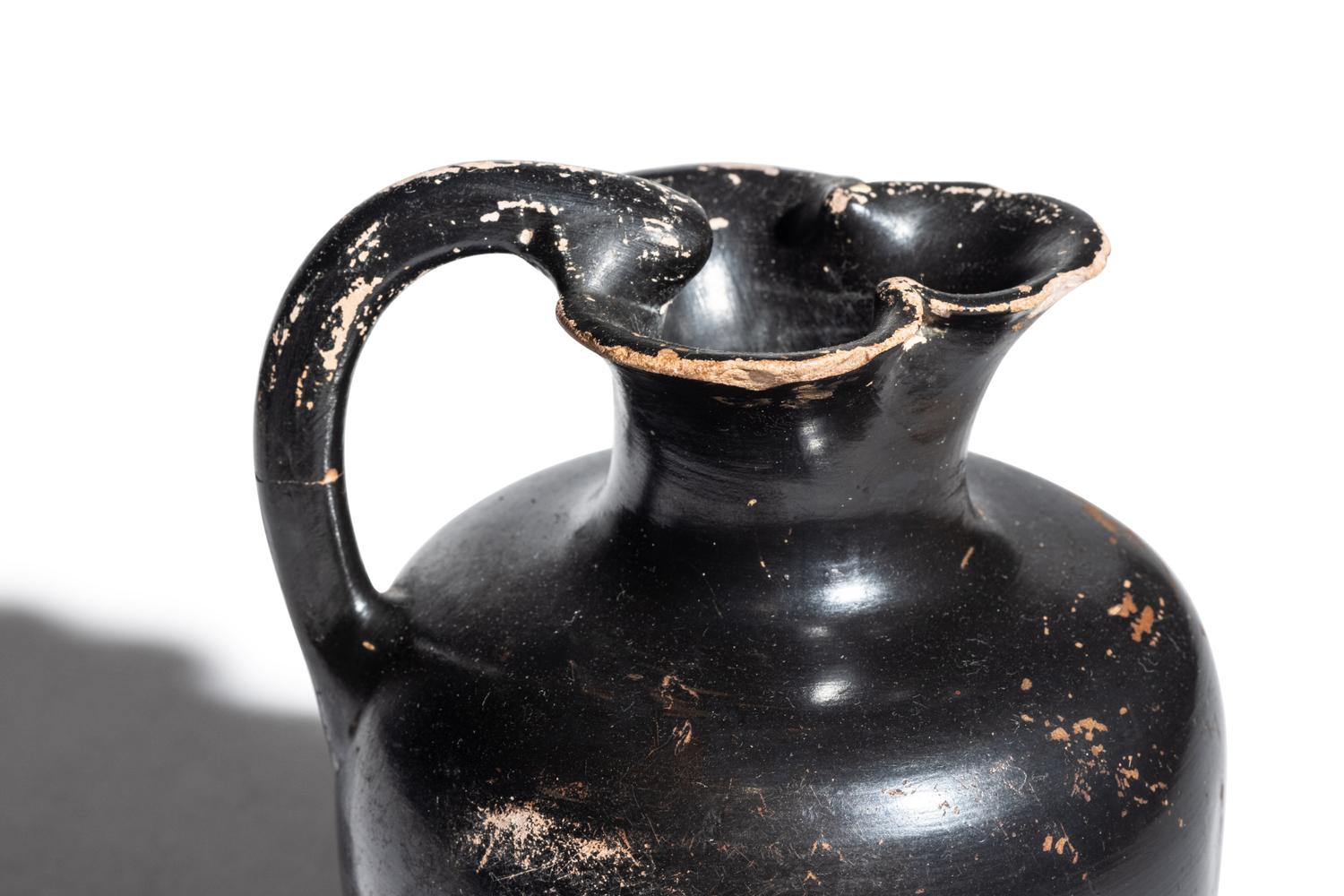 A Greek Black-Glazed Trefoil Oinochoe