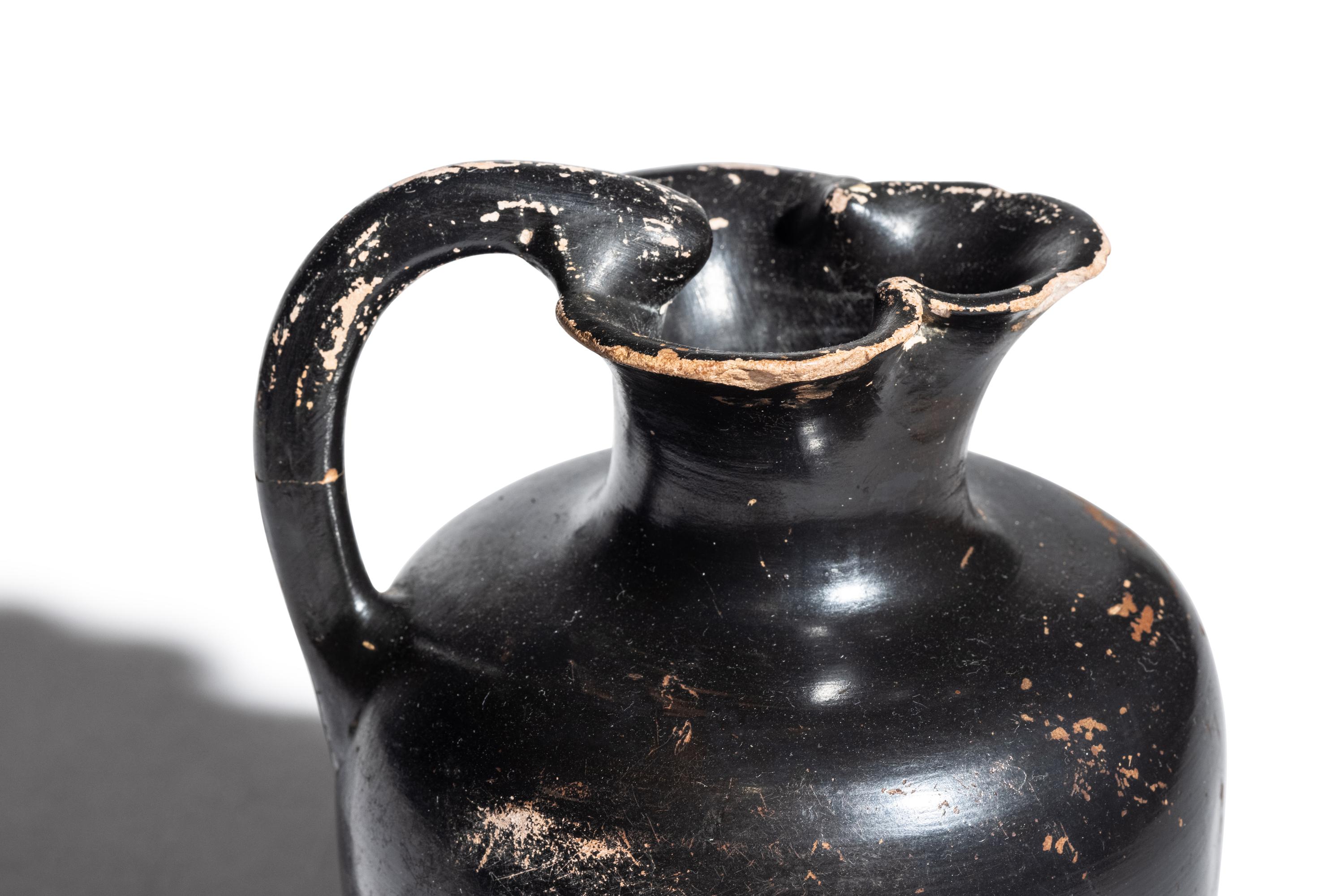 A Greek Black-Glazed Trefoil Oinochoe