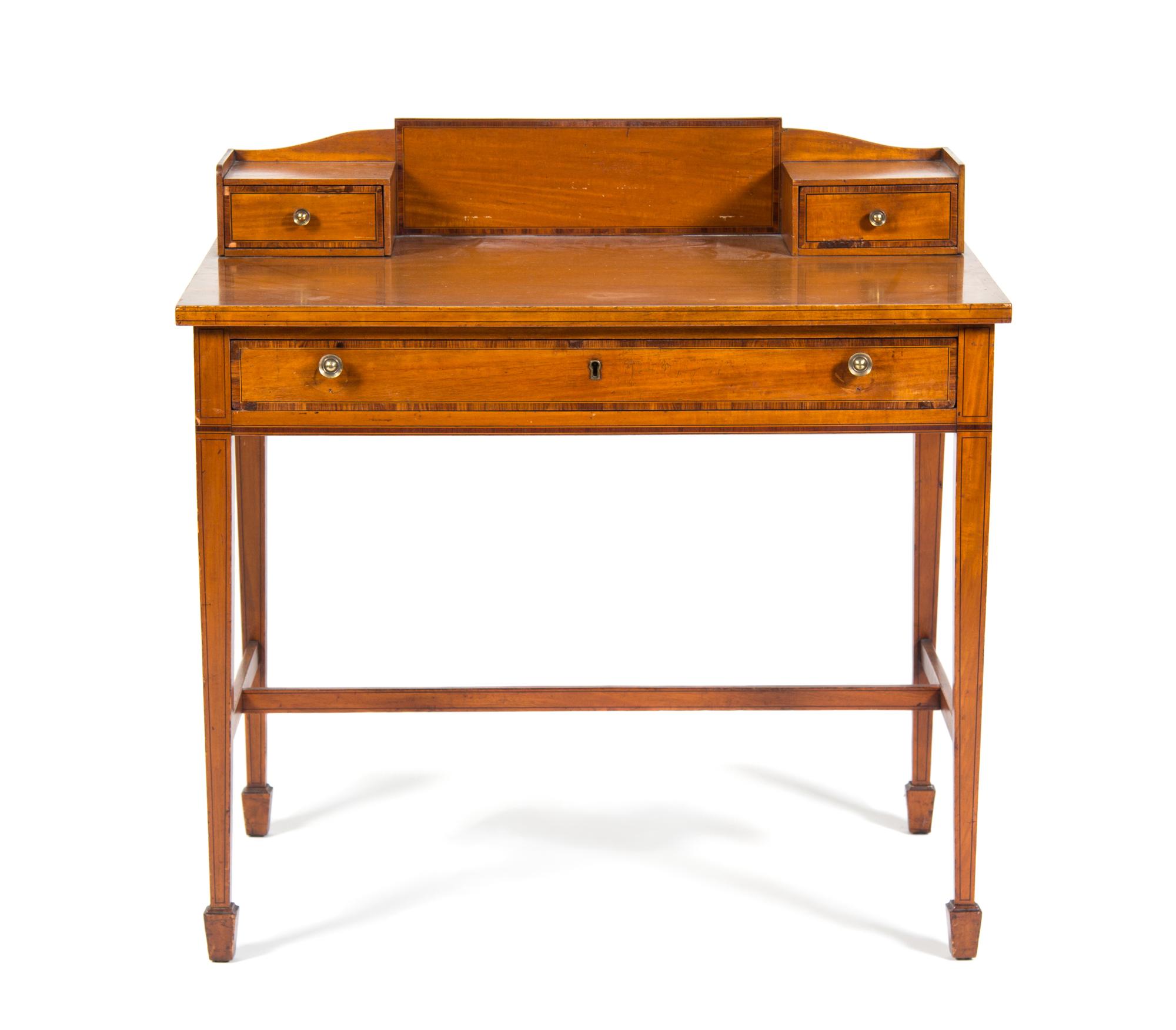 An Edwardian Satinwood Writing Table Height 33 1/2 x width 34 x depth 22 1/4 inches.