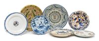 Seven Continental Ceramic Chargers, Diameter of largest 16 3/4 inches.