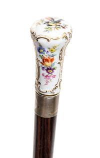 A Meissen Style Porcelain Handled Walking Stick, Length of handle 2 3/4 x length overall 31 1/2 inches.