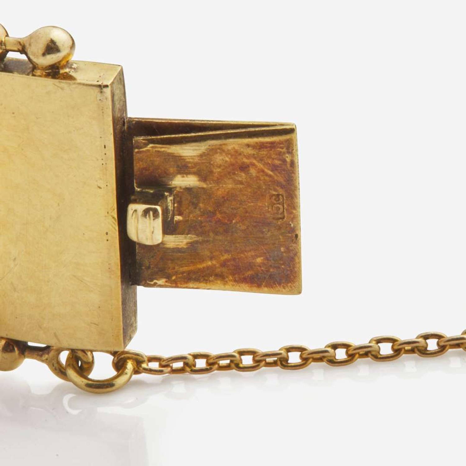 An Antique Yellow Gold Bangle Bracelet with Applique Charms